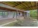 Exterior view of a spacious deck with seating, overlooking lush trees and lake views at 4749 16Th Street Ne Dr, Hickory, NC 28601