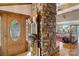 Inviting foyer with hardwood floors, stone accents and a beautiful wooden door at 4749 16Th Street Ne Dr, Hickory, NC 28601