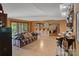 Open-concept living room with exposed stone fireplace, bar, and access to the outdoors at 4749 16Th Street Ne Dr, Hickory, NC 28601