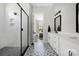 Beautiful bathroom showcasing a modern walk-in shower and elegant double vanity at 5028 Lewis Rd, Gastonia, NC 28052