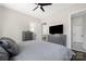 Comfortable bedroom featuring a ceiling fan, modern furnishings, and stylish interior doors at 5028 Lewis Rd, Gastonia, NC 28052