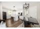Bright kitchen featuring white cabinets, an island with seating, and stainless steel appliances at 5028 Lewis Rd, Gastonia, NC 28052