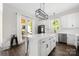 Bright kitchen with stainless appliances, island seating, and access to an outdoor deck at 5028 Lewis Rd, Gastonia, NC 28052