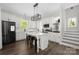 Modern kitchen with a white island, sleek appliances, and ample cabinet space at 5028 Lewis Rd, Gastonia, NC 28052