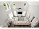 An aerial view showcases the spacious living room's soaring ceiling, large windows, and comfy seating area at 5028 Lewis Rd, Gastonia, NC 28052
