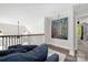 Cozy loft with a comfortable blue chaise lounge, stylish railing, and eye-catching artwork at 5028 Lewis Rd, Gastonia, NC 28052