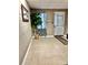 Clean basement area with tile flooring, neutral walls, and a door to the outside at 5933 Flintlock Ct, Hickory, NC 28601