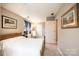 Cozy bedroom with natural light, soft carpet, and neutral wall colors at 5933 Flintlock Ct, Hickory, NC 28601