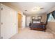 Spacious bedroom with carpet flooring, large closet, and natural light at 5933 Flintlock Ct, Hickory, NC 28601