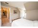 Neutral bedroom featuring carpet and an adjacent view into the hallway at 5933 Flintlock Ct, Hickory, NC 28601
