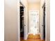 Bedroom hallway with closets leading to the main bathroom with a soaking tub at 5933 Flintlock Ct, Hickory, NC 28601