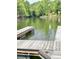 View of an empty wooden dock on the lake at 5933 Flintlock Ct, Hickory, NC 28601
