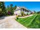 Home features a three-car garage, driveway, and manicured lawn at 5933 Flintlock Ct, Hickory, NC 28601