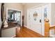 Elegant foyer with hardwood floors, decorative front door, and staircase access at 5933 Flintlock Ct, Hickory, NC 28601