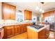 Well-appointed kitchen featuring custom cabinetry, granite countertops, and stainless steel appliances at 5933 Flintlock Ct, Hickory, NC 28601