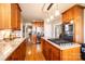 Spacious kitchen with granite counters, a large island with a gas cooktop, and hardwood floors at 5933 Flintlock Ct, Hickory, NC 28601
