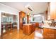 Spacious kitchen with a granite island and countertops, stainless steel appliances, and hardwood flooring at 5933 Flintlock Ct, Hickory, NC 28601