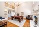 Bright living room with high ceilings, fireplace, and a beautiful antique pool table at 5933 Flintlock Ct, Hickory, NC 28601