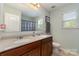Bright bathroom featuring a double vanity and updated fixtures at 6040 Fazio Ct, Harrisburg, NC 28075