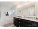 Bathroom with double sinks, and a separate shower and tub at 6040 Fazio Ct, Harrisburg, NC 28075