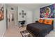 Bedroom featuring an accent wall, art, and desk space at 6040 Fazio Ct, Harrisburg, NC 28075