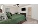 Spacious bedroom with a ceiling fan, large window and a stylish dresser at 6040 Fazio Ct, Harrisburg, NC 28075