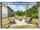 Cozy fire pit area with comfortable seating, perfect for outdoor gatherings and relaxing evenings at 6040 Fazio Ct, Harrisburg, NC 28075