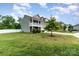 Charming two-story home with a well-manicured front lawn and a welcoming porch at 6040 Fazio Ct, Harrisburg, NC 28075