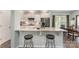 Bright kitchen featuring granite countertops, a breakfast bar, and modern stainless steel appliances at 6040 Fazio Ct, Harrisburg, NC 28075
