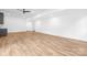Spacious basement area with neutral paint and light wood grain floors at 632 Dorothy Dr, Charlotte, NC 28203