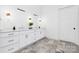 Bright bathroom with double vanity, quartz countertops, and modern fixtures at 632 Dorothy Dr, Charlotte, NC 28203