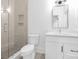 Contemporary bathroom featuring glass shower, white walls, and modern fixtures at 632 Dorothy Dr, Charlotte, NC 28203