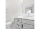 Bright bathroom with white cabinets, modern fixtures, and tiled shower at 632 Dorothy Dr, Charlotte, NC 28203