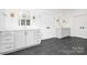 Spacious bathroom with double vanity, white cabinets, and modern lighting at 632 Dorothy Dr, Charlotte, NC 28203