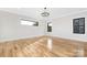 Spacious bedroom with hardwood floors and sleek, modern lighting at 632 Dorothy Dr, Charlotte, NC 28203
