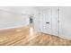 Spacious bedroom with double doors, ceiling fan, and hardwood floors at 632 Dorothy Dr, Charlotte, NC 28203