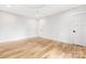 Bright bedroom featuring hardwood floors and modern ceiling fan at 632 Dorothy Dr, Charlotte, NC 28203