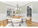 Elegant dining room with hardwood floors, chandelier, and natural light, great for gatherings at 632 Dorothy Dr, Charlotte, NC 28203
