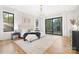 Serene main bedroom with hardwood floors, natural light, and balcony access for a relaxing retreat at 632 Dorothy Dr, Charlotte, NC 28203