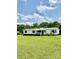 Charming single-story home with a front porch, nestled in a green lawn and wooded area at 645 E Border E Rd, Rock Hill, SC 29730