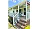 Inviting front porch with brick steps, white railing, and space to relax and enjoy the outdoors at 645 E Border E Rd, Rock Hill, SC 29730