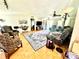 Relaxing living room offers ample seating, wood floors, and modern ceiling fans at 645 E Border E Rd, Rock Hill, SC 29730