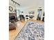 Well-lit living room features hardwood floors, a brick fireplace, and neutral paint at 645 E Border E Rd, Rock Hill, SC 29730