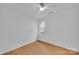 Bedroom with modern ceiling fan and light toned wood flooring at 7328 Starvalley Dr, Charlotte, NC 28210
