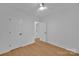 Clean bedroom with light toned wood flooring at 7328 Starvalley Dr, Charlotte, NC 28210