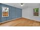 Stylish bedroom with modern wall paneling and wood flooring at 7328 Starvalley Dr, Charlotte, NC 28210