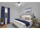 A serene bedroom features a plush bed with a gray headboard and soft, neutral accents at 7328 Starvalley Dr, Charlotte, NC 28210