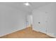 Bright bedroom features modern ceiling fan and light toned wood flooring at 7328 Starvalley Dr, Charlotte, NC 28210