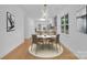A stylish dining room features modern lighting, a round table, and elegant decor at 7328 Starvalley Dr, Charlotte, NC 28210