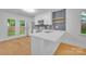 Bright kitchen with stainless steel appliances, white cabinets and access to back yard at 7328 Starvalley Dr, Charlotte, NC 28210